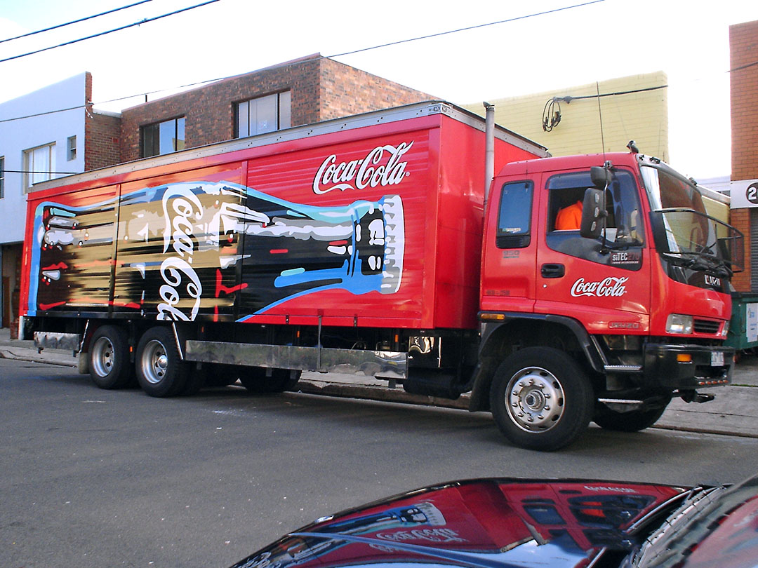 A red truck with Coke Cola graphics